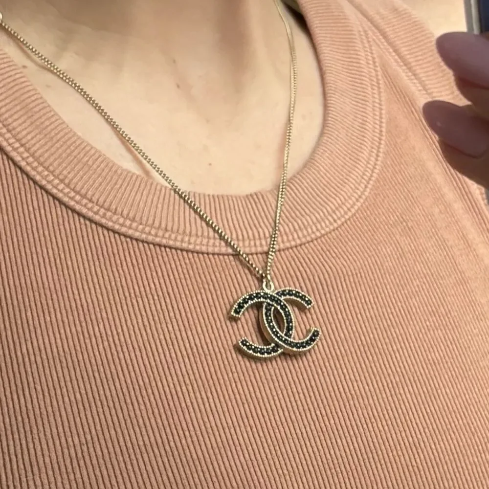 Chanel gold and black pearl CC pendant necklace, Authentic